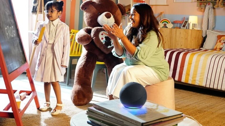 Mother and child using Echo Dot in playroom