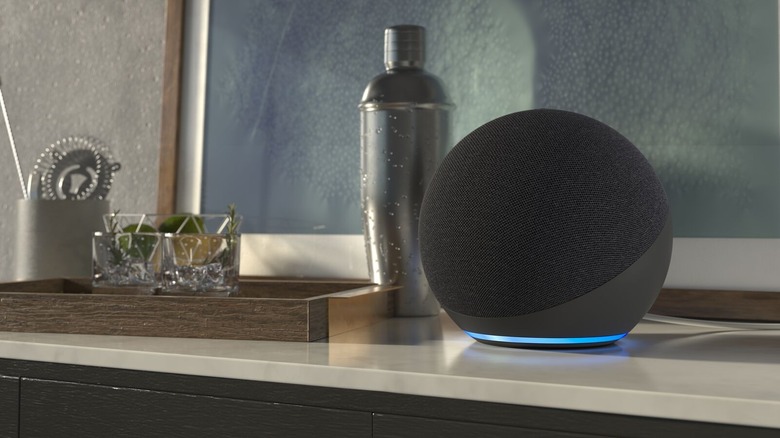 Echo Dot on a table with cocktail equipment