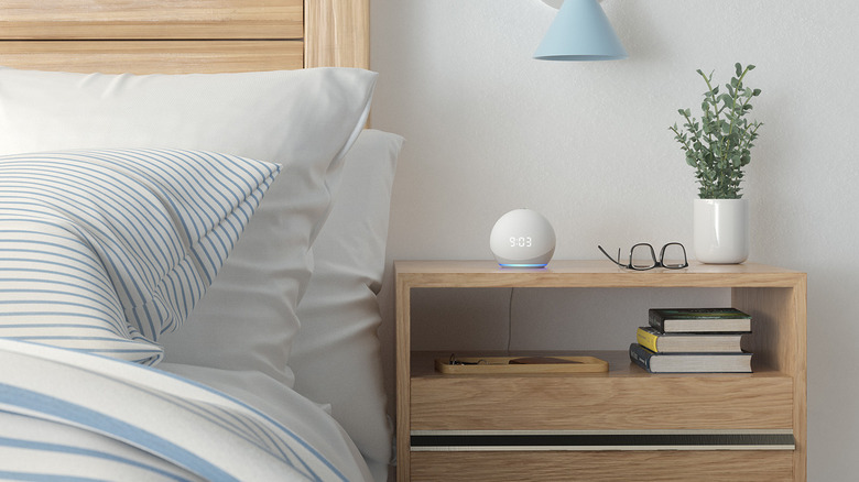 Echo Dot on bedside table next to plant