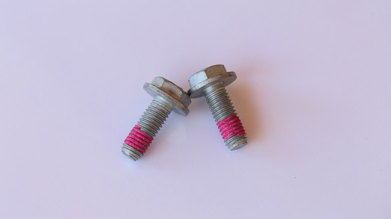 Bolts with red threadlocker