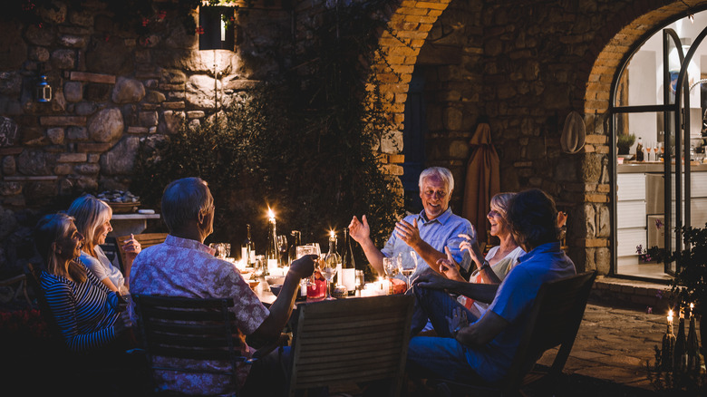 friends enjoying nice patio at night