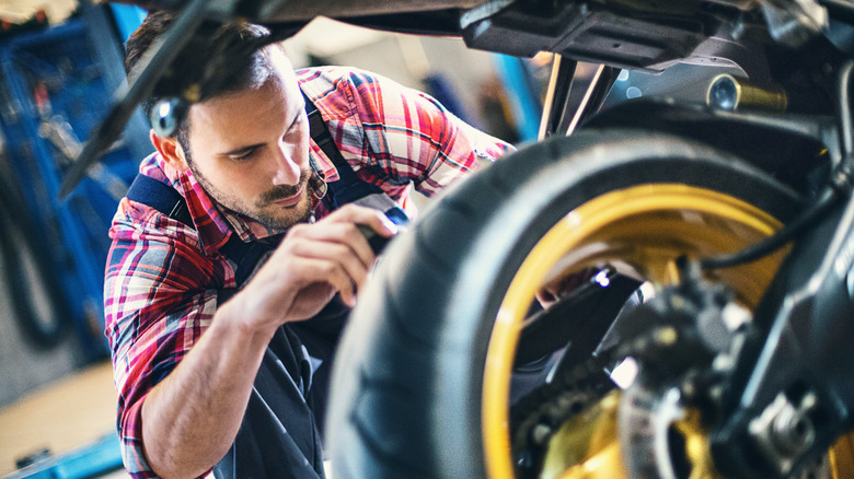 Man working on motorcycle