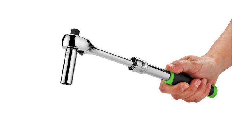 Person holding a ratchet tool