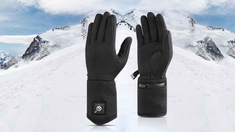 Heated glove liners with snowy mountain background