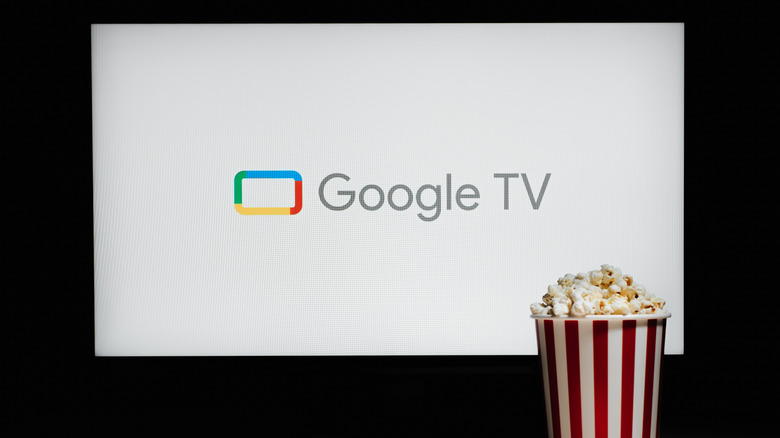 A white screen with Google TV and a tub of popcorn