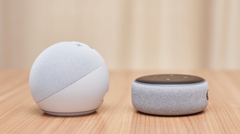 White Amazon Echo and Echo Dot on a table