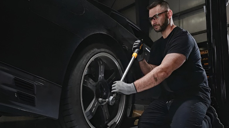 A person using the DeWalt 1/2-inch drive torque wrench