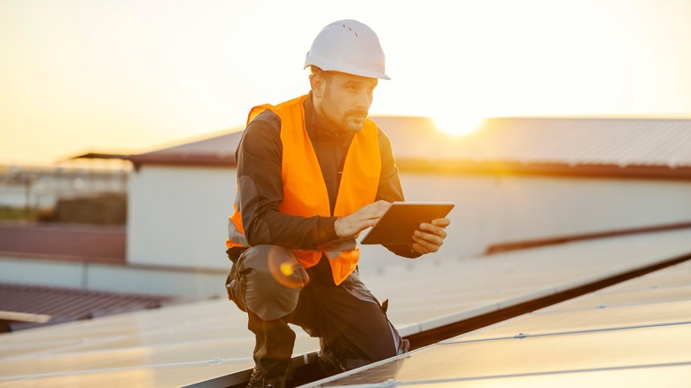 Worker on solar panels