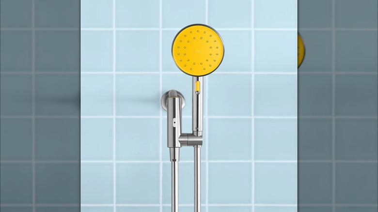 A hai smart shower head mounted on a shower wall