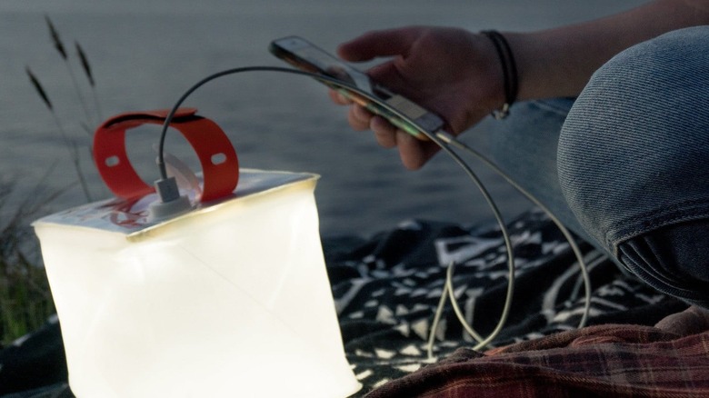 LuminAID Packlite charging a phone