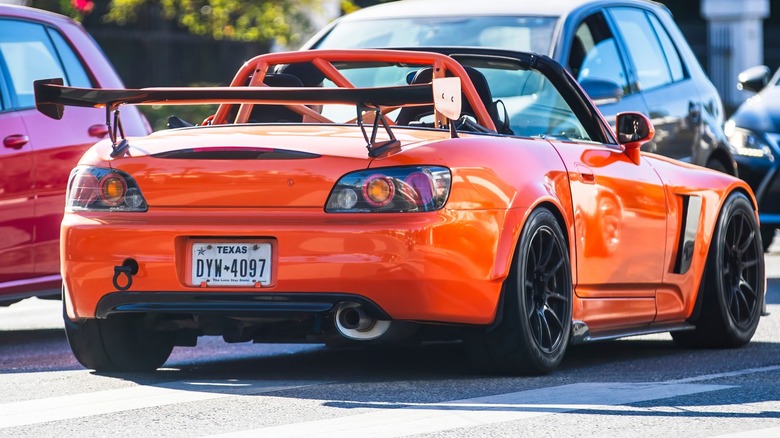 An orange Honda s2000 convertible