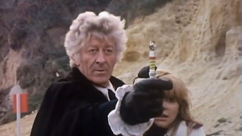 The Doctor wields a sonic screwdriver