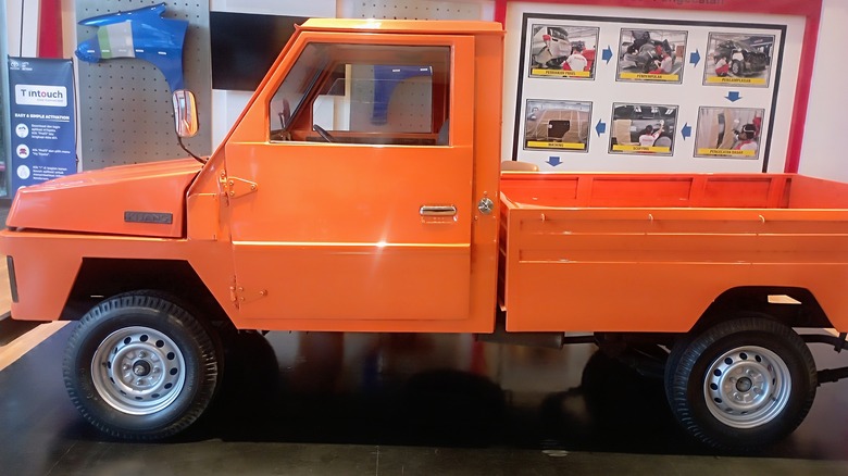 Orange first generation Toyota Kijang