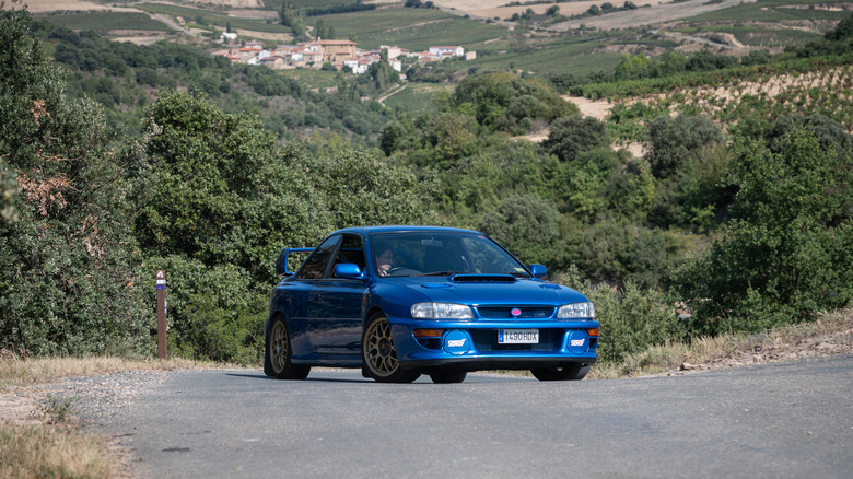 Person driving Subaru Impreza 22B STI