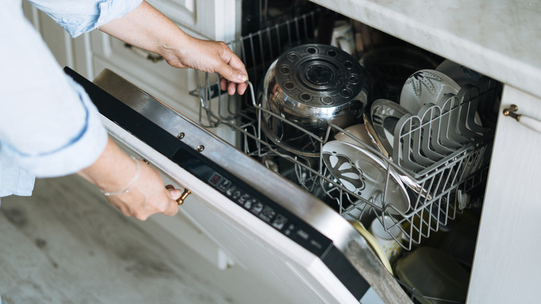 open dishwasher with dirty dishes