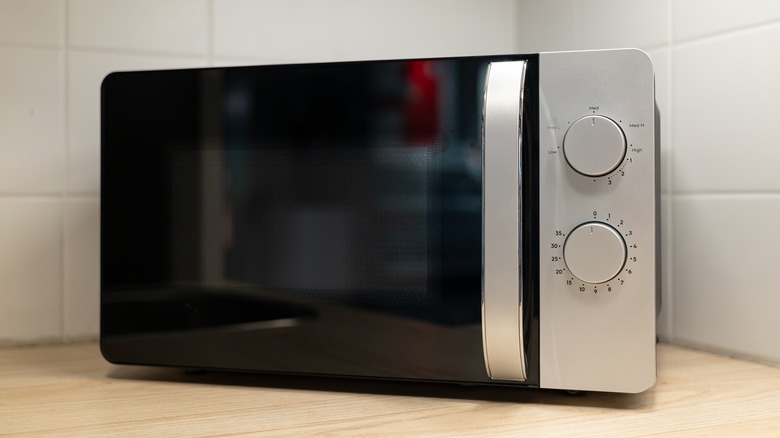 microwave oven on wooden counter