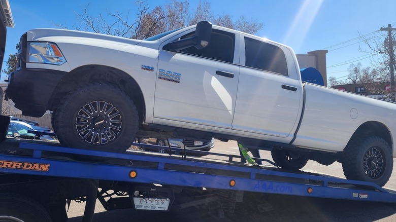 2018 Ram 3500 loaded on flatbed wrecker