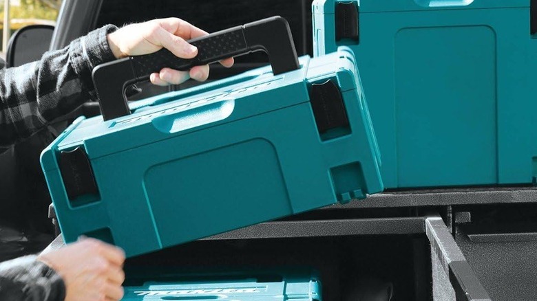 Person holding Makita interlocking case