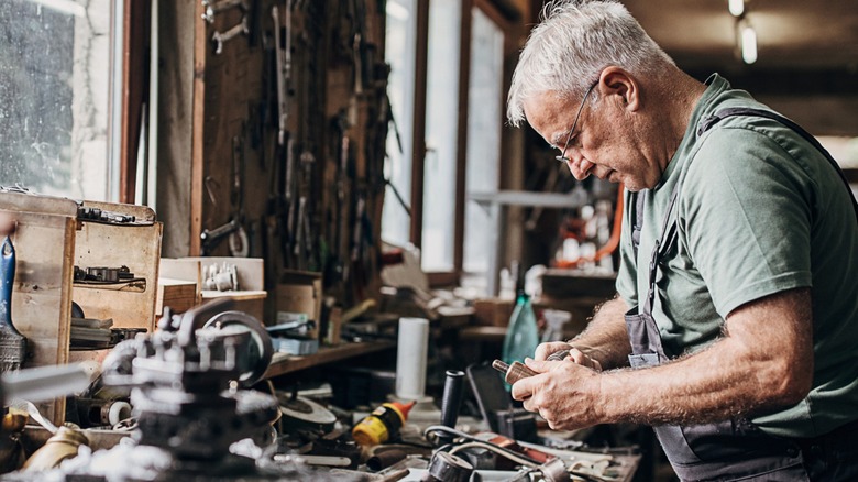 Mechanic and cluttered tool bench