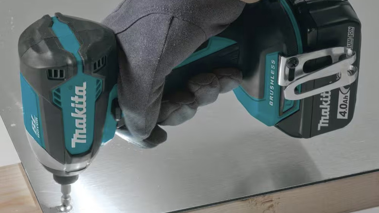 Makita impact drill being used on a screw