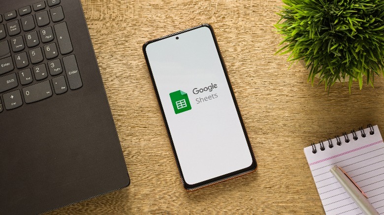 Google Sheets logo on a phone