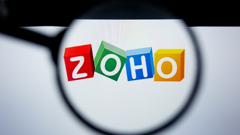 Zoho logo seen through a magnifying glass