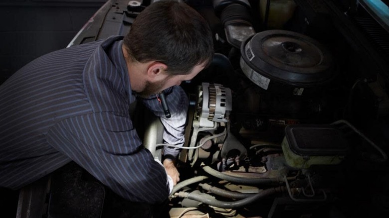 mechanic using Milwaukee penlight