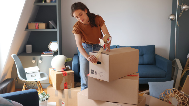 person packing moving boxes