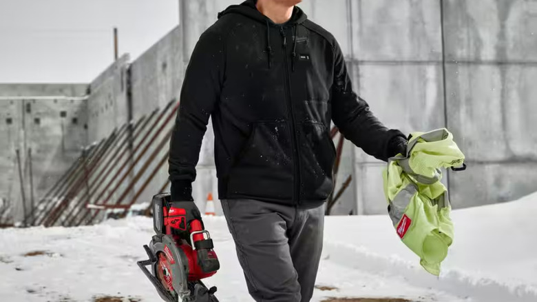 Man walking with Milwaukee tool in hand