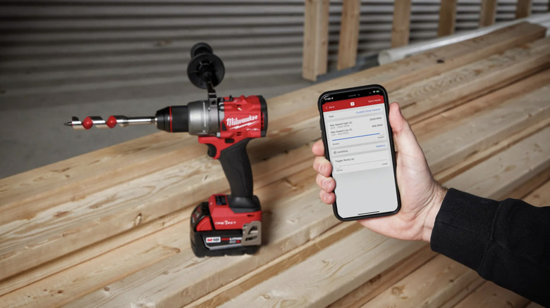 M18 Fuel ½-inch Cordless Drill/Driver and One-Key app on phone