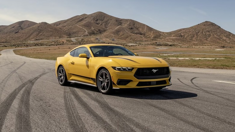 yellow Ford Mustang on a track