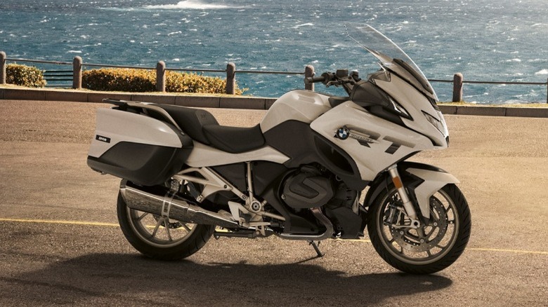 BMW R 1250 RT parked in street near ocean