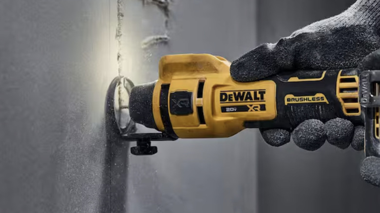 DeWalt tool cutting into drywall