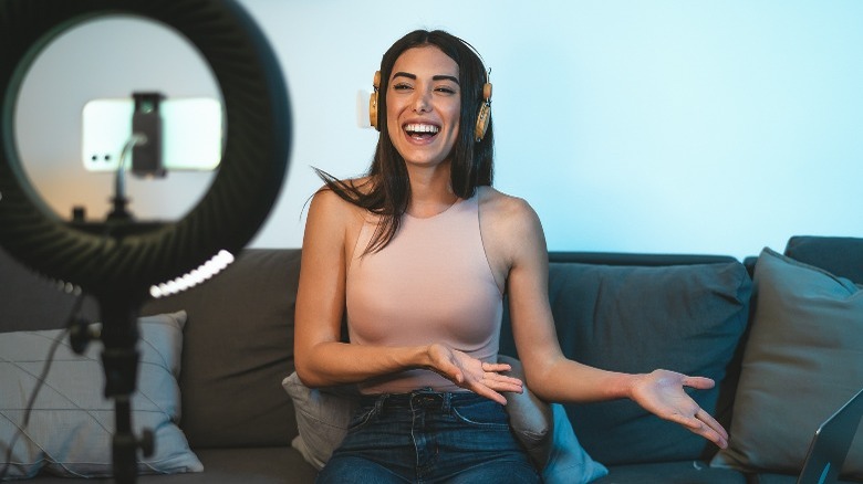 Woman recording herself with her phone