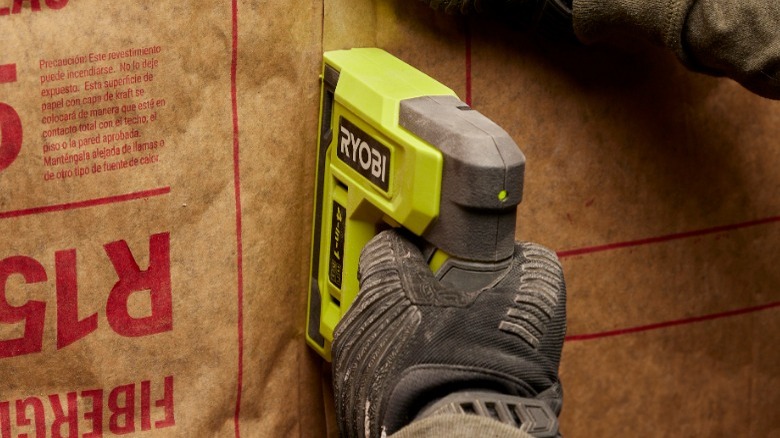 Person using Ryobi stapler