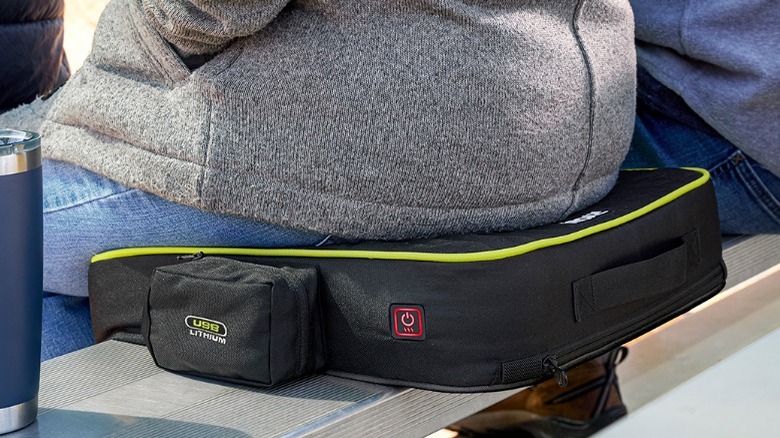 Person sitting on Ryobi cushion