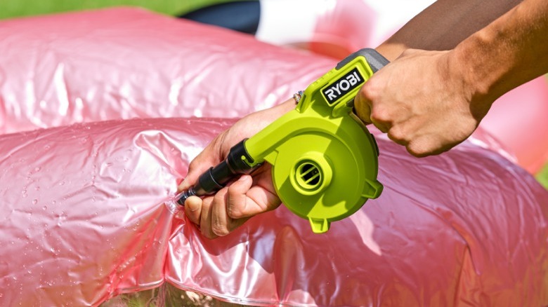 Person using Ryobi inflator