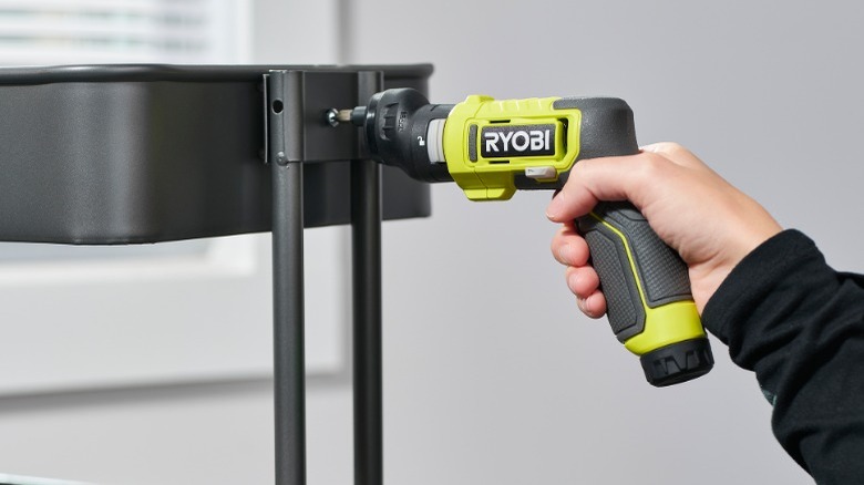 Person using Ryobi power screwdriver