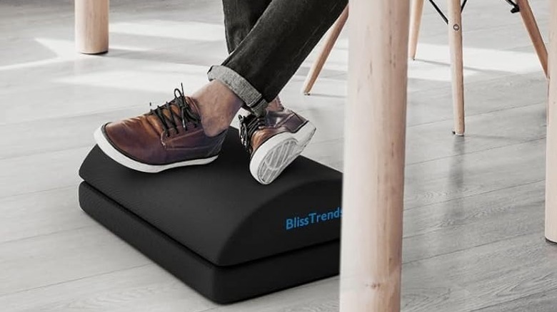 the BlissTrends foot rest under a desk