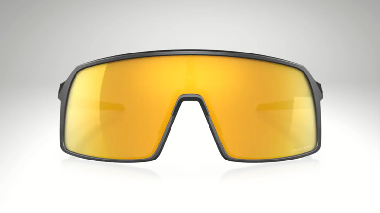 Front view of yellow Oakley Sutro sunglasses on white background