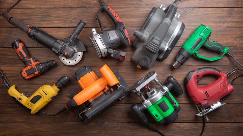 A collection of corded power tools on a table