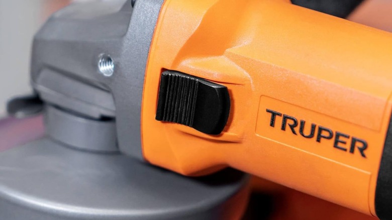 A closeup image of a Truper angle grinder