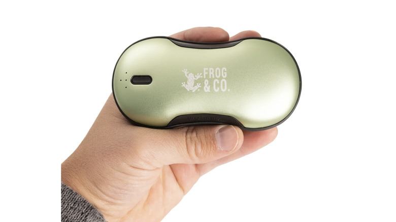 Hand holding Survival Frog QuickHeat Pro Rechargeable Hand Warmer