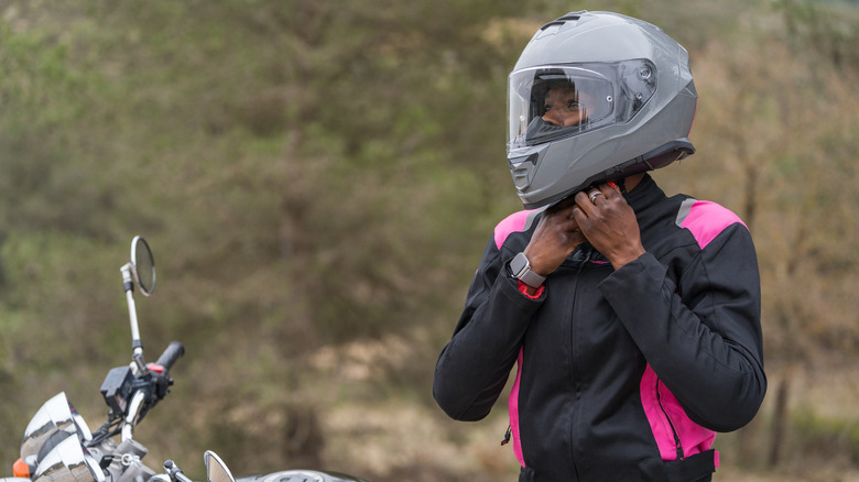 Woman dressed in motorcycle jacket