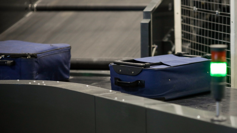 luggage on airport conveyor belt