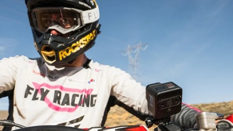 GoPro camera mounted on motorcycle handlebar and aimed at rider