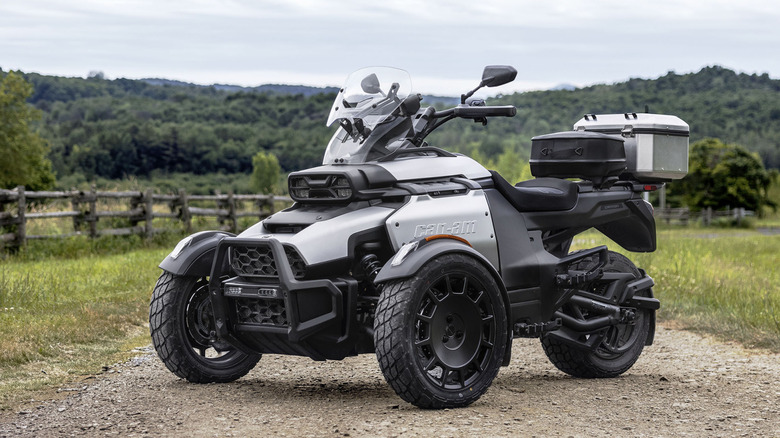 A silver Can-Am Canyon parked on dirt road