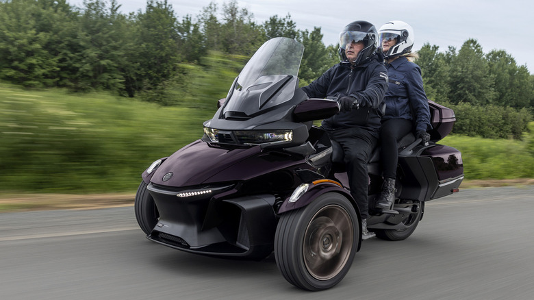 The Can-Am Spyder RT Sea-to-Sky with driver and passenger on road