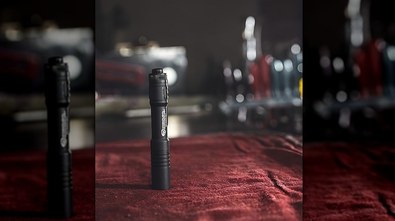 Streamlight flashlight on red fabric