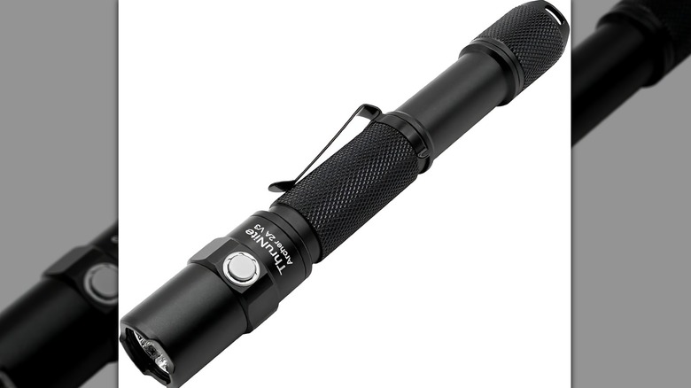 ThruNite flashlight on white background